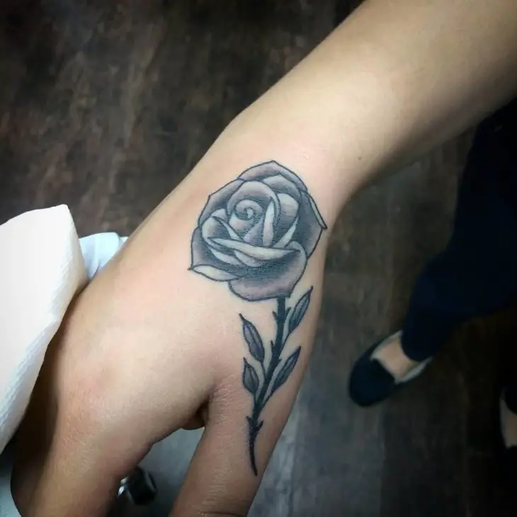 rose tattoo on hand