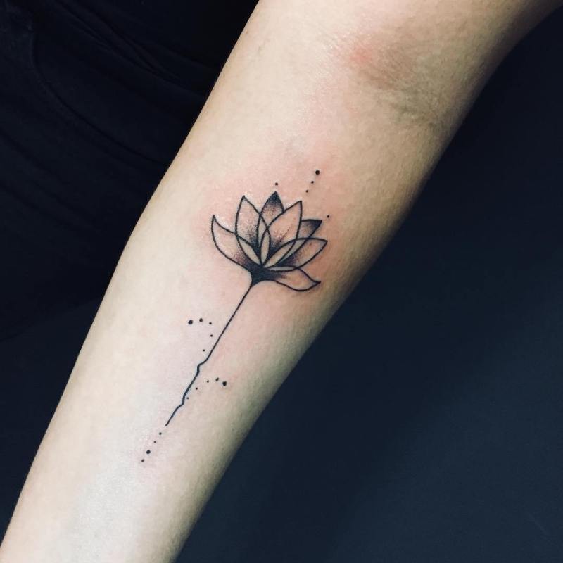 Female lotus flower tattoo on arm