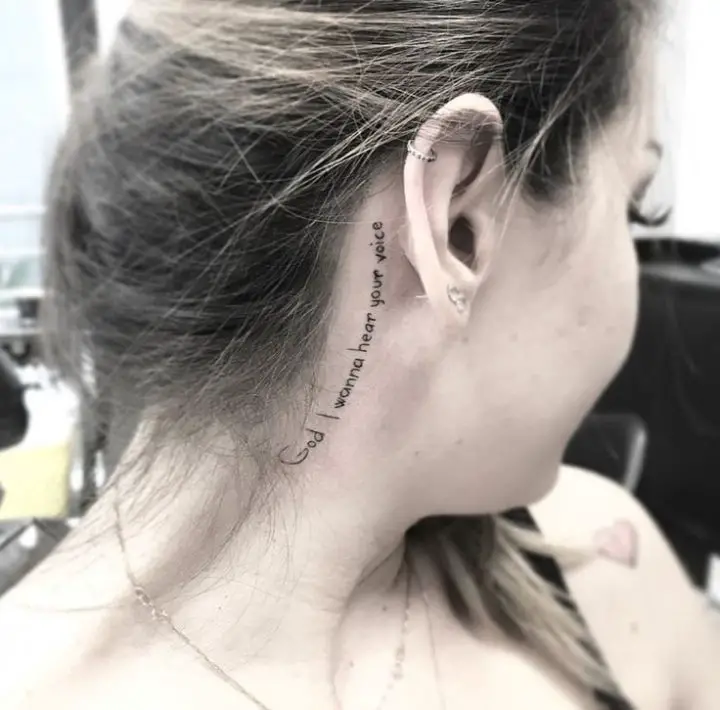 Written behind the ear tattoo