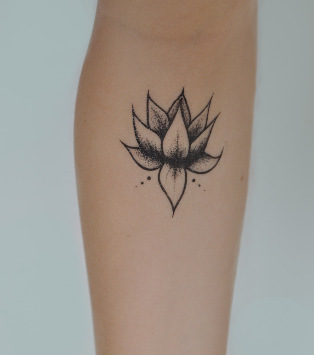 lotus flower tattoo on arm