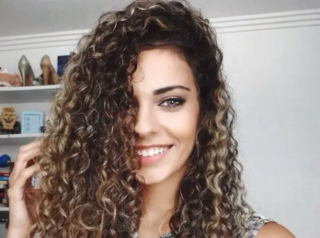 curly lit brunette